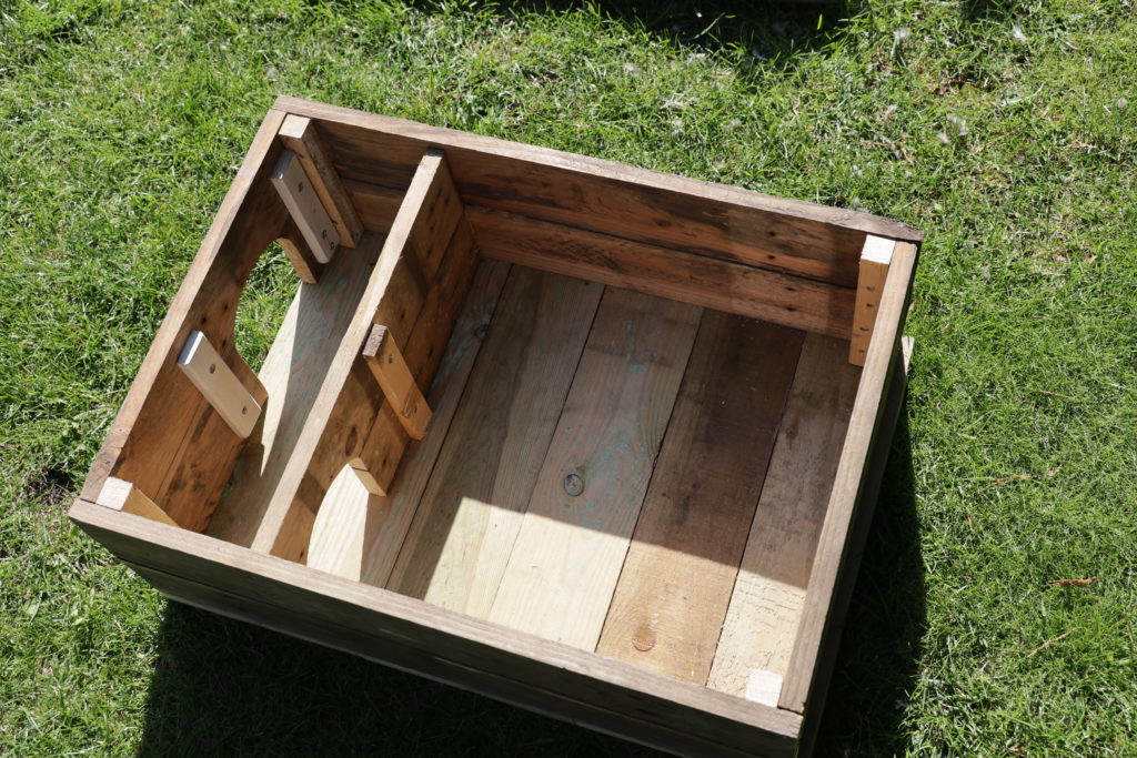 making a hedgehog house from scrap pallet wood showing the inside