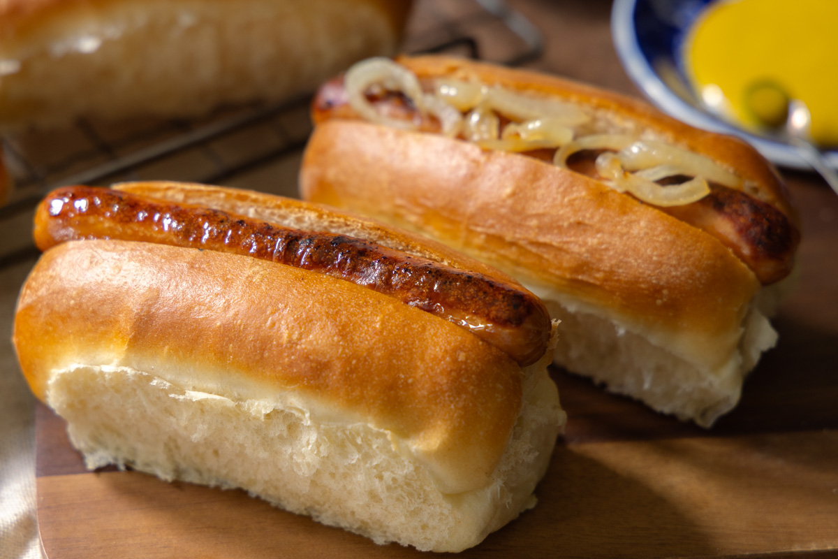 hotdog rolls recipe freshly baked homemade hotdog rolls filled with sausages and fried onions