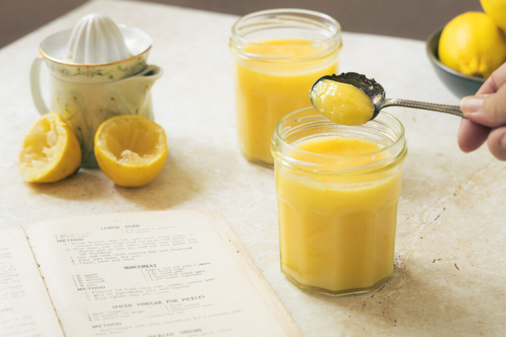 traditional homemade lemon curd in glass jars